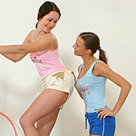 Hot cuties rip off clothes and lick pink pussies in gym