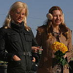 Enticing blondes stroll then strip and eagerly lick pussies