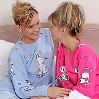 Adorable teens lick and toy hot pussies to orgasm in bed