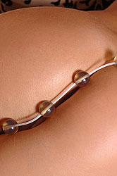 Young Bellina inserting toy in ass