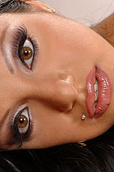 Brunette show off her tanned body