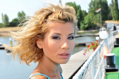 Skinny blonde babe Iona is anal fucked on a boat