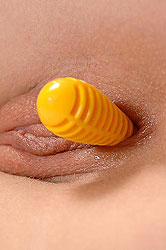 Teen Gitta Blond plays with rattles