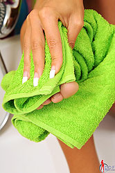 Hot Ashley washes her legs and feet