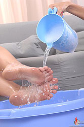 Two young blondes have lesbian bath