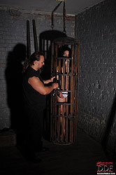 Bound naked Bianka spanked in cage