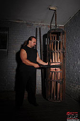 Bound naked Bianka spanked in cage