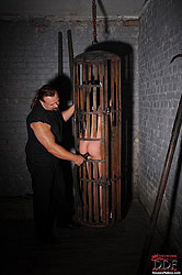 Bound naked Bianka spanked in cage