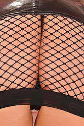 Latex blonde teasing her round tits