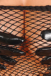 Latex blonde teasing her round tits