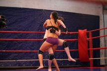 Angel Rivas and Niky Gold are fighting in a ring