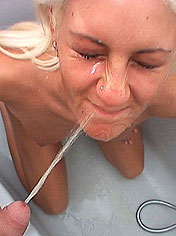 Blond filthy Tia gets facial in a hard pissing act