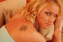 Kathia Nobili is stripping and dildoing her pussy