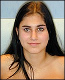 Sexy brunette teenage webcam girl showing her firm boobies