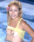 Petite teenage cutie showing her body in a swimming pool