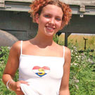 Teenage redhead toying her wet and tight muff in the garden