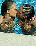 Two wet and wild British lesbians splashing in the pool