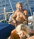 Two horny seniors fucking a blonde hottie on their boat