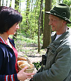 Old senior hunter fucking a brunette beauty in the wild