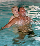 Cute female swim instructor banging a senior after drowning