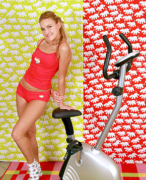 Naughty teenie girl doing a naked workout with her toys