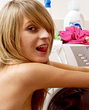 Two cute blonde teenagers doing the laundry fully naked