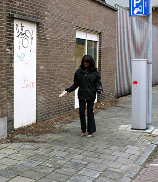 Ebony girl gets surprised with a cock trough a gloryhole