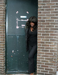 Ebony girl gets surprised with a cock trough a gloryhole