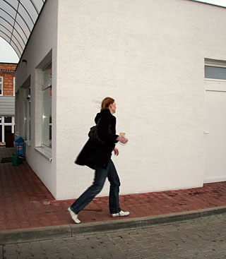 Redhead girl enjoys a big surprise erection trough the wall