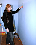 Redhead girl enjoys a big surprise erection trough the wall