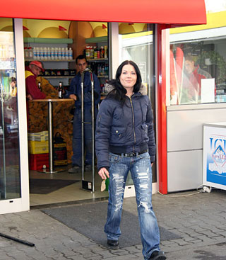  Brunette girl sucking a stiffy penis on a public toilet