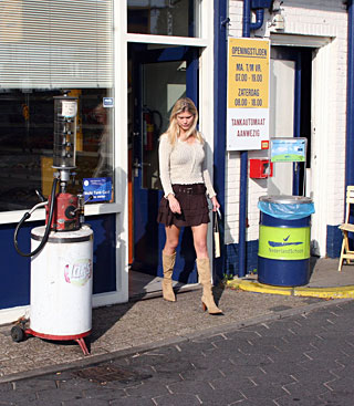 Blonde honey gets a big toilet surprise trough the wall