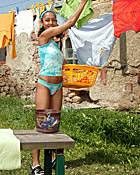 Cute ebony teenager loves playing naked in the backyard