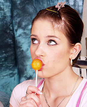 Brunette lollipop licking teen handles a big erected cock