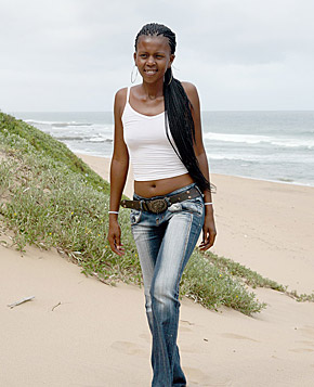 Cute ebony teenager showing her nude goods on the beach