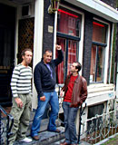 Slutty prostitute pleasing two guys their cock at same time