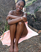 Black teenage girl showing her big natural tits outdoor