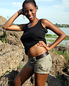 Black teenage girl showing her big natural tits outdoor