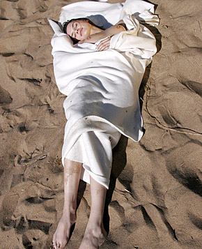 Cute natural teenage brunette goes fully naked on the beach