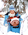Teenage brunette showing off her massive mellons in the snow