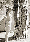 Vintage nudist going fully naked on the natural camping
