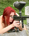 Big breasted paintballing redhead goes fully naked outdoor