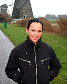  Dutch teen girl flashing her tits in front of windmills