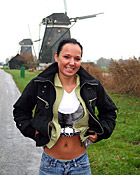  Dutch teen girl flashing her tits in front of windmills