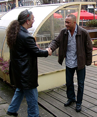 Heavy blonde hooker with big tits jerking an Italian cock