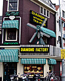 Heavy blonde hooker with big tits jerking an Italian cock