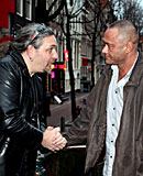 Heavy blonde hooker with big tits jerking an Italian cock