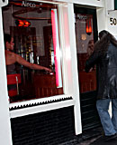 Heavy blonde hooker with big tits jerking an Italian cock