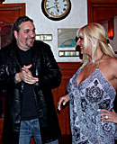 Heavy blonde hooker with big tits jerking an Italian cock