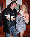 Heavy blonde hooker with big tits jerking an Italian cock